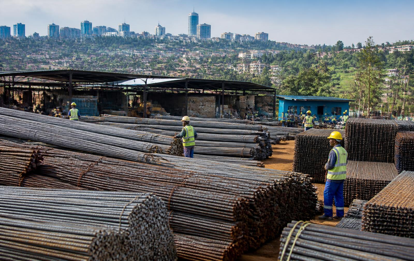 Bundles of rebar and welded mesh stacked at a steel supply yard above Kigali, Rwanda